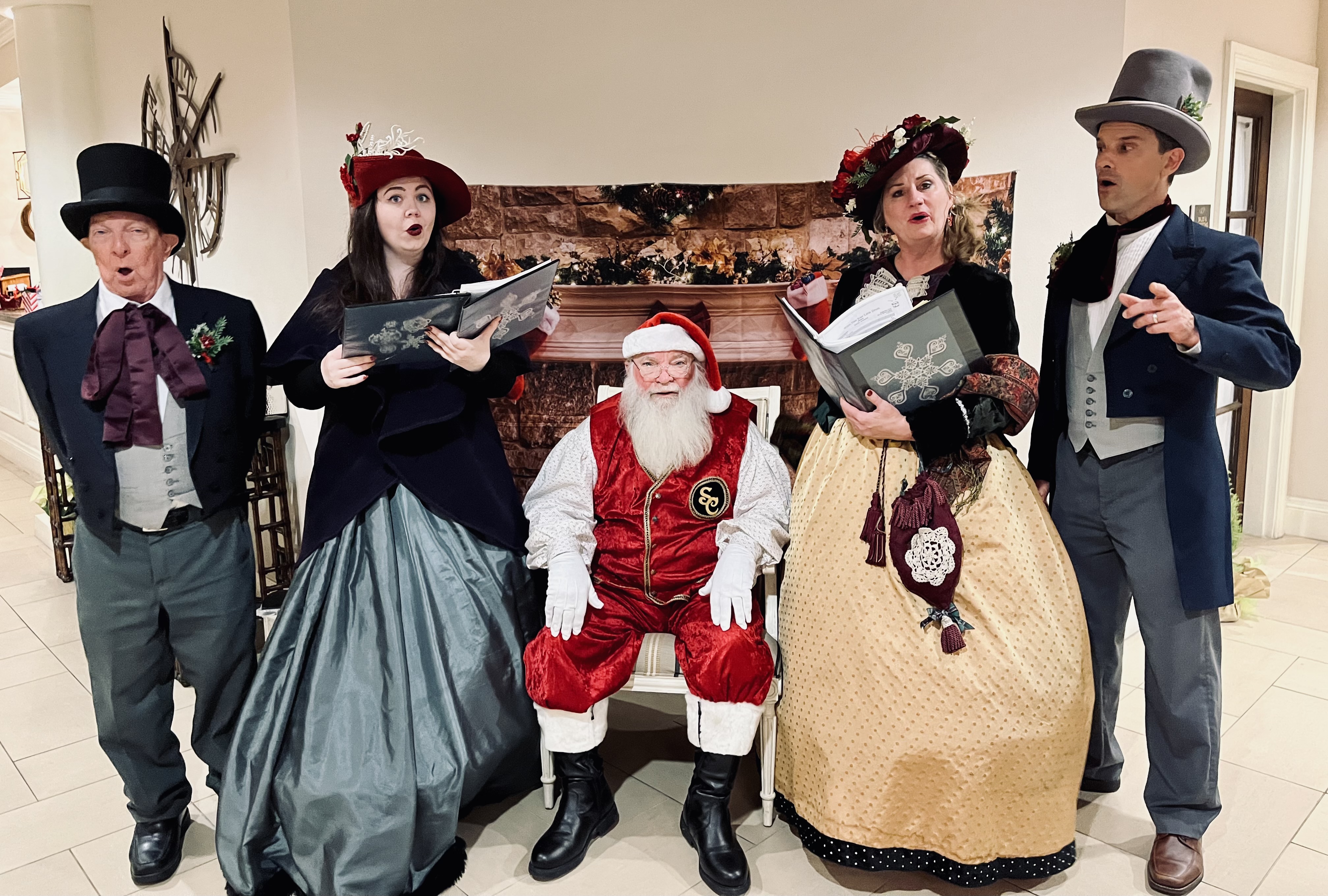 Carolers singing with Santa